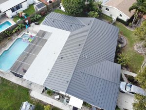 Ribbed metal roof on a Floridian home with swimming pool