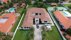 brown shingle roofing on a house in a posh Florida area
