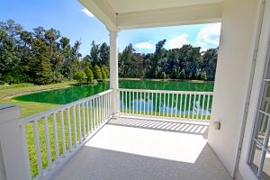 Picture of a beautiful white balcony overlooking yard